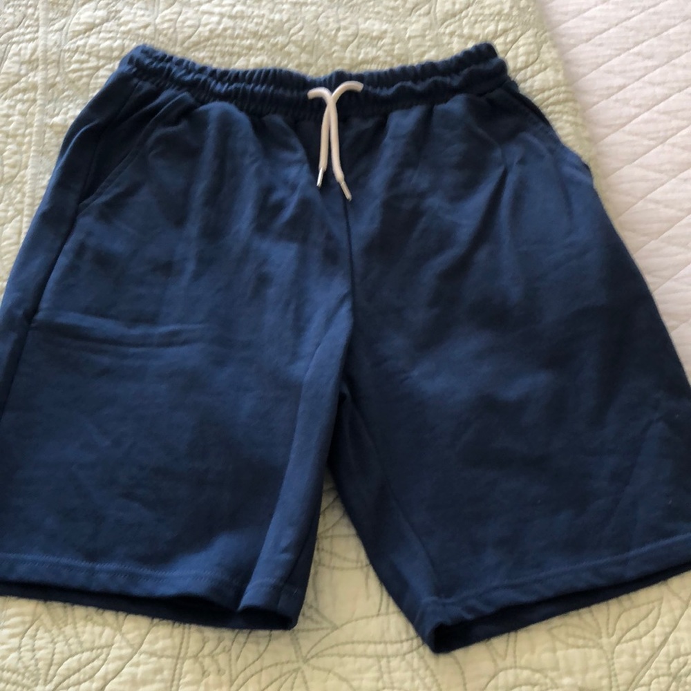3 pr men’s shorts size medium. 1 navy knit, 1 brown woven, and 1 cream linen.